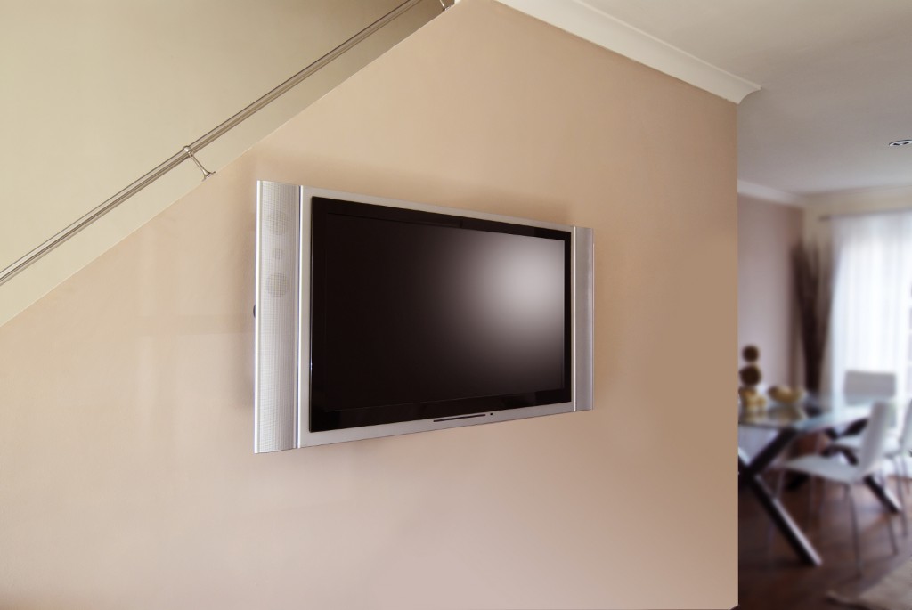 Wall mounted LCD or Plasma flatscreen Television in home lounge
