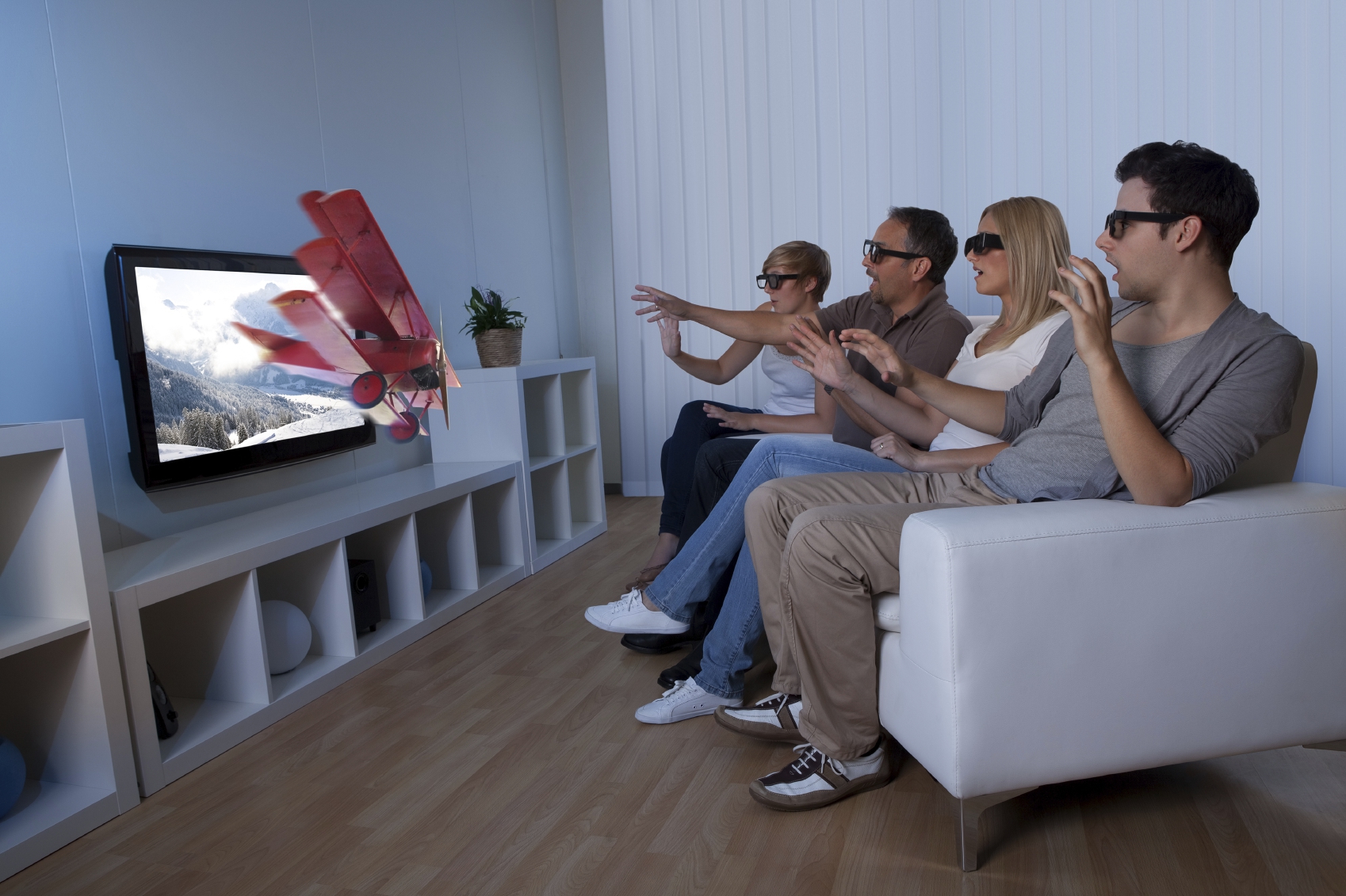 Family Watching TV from Electronic World