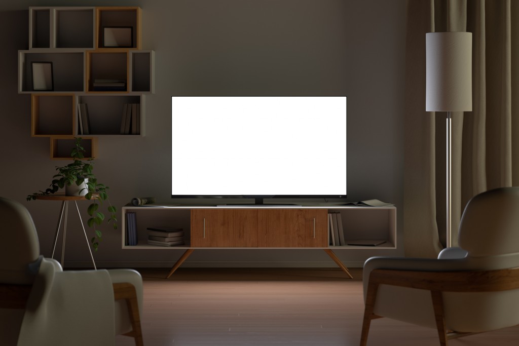 Tv mockup in living room at night. Tv screen, tv cabinet, chairs, bookshelf. 3d illustration