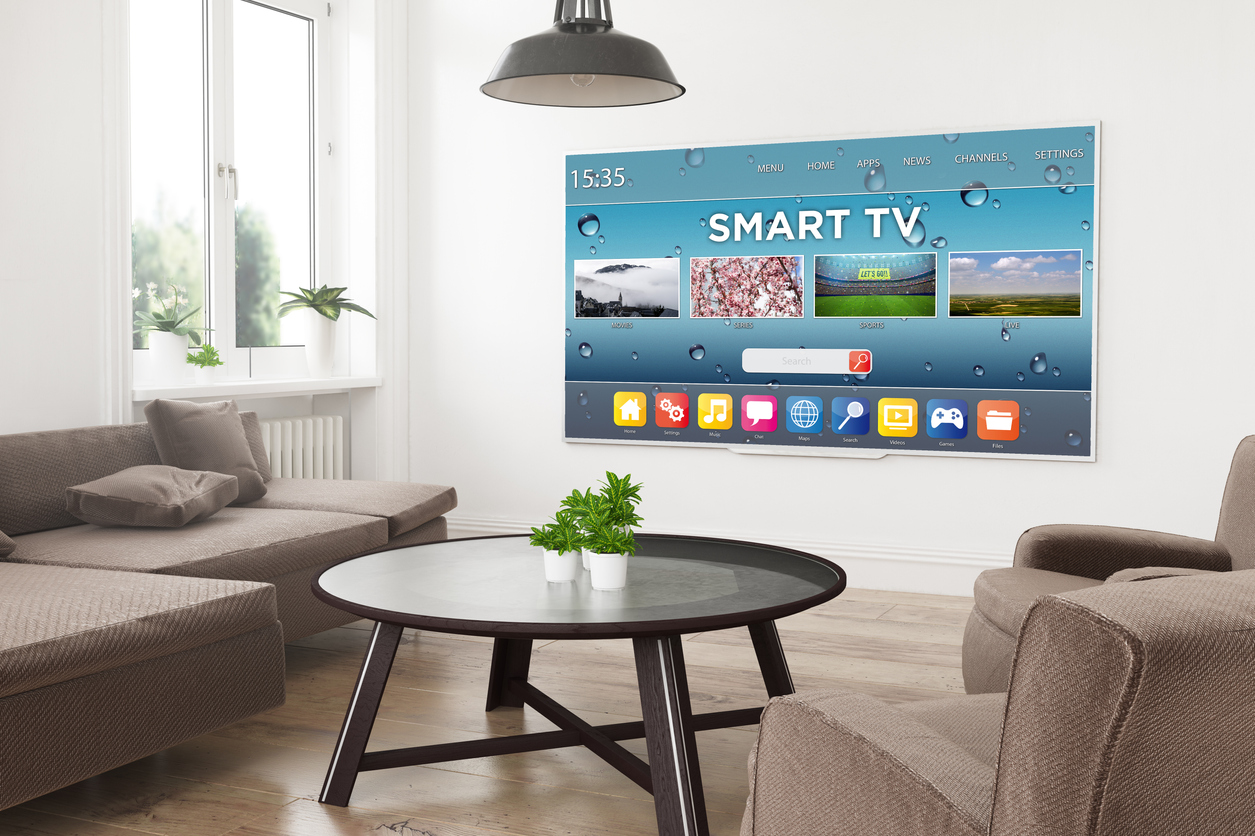 A smart TV mounted on a wall in a modern home