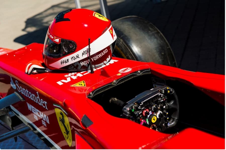 A red race car with a helmet