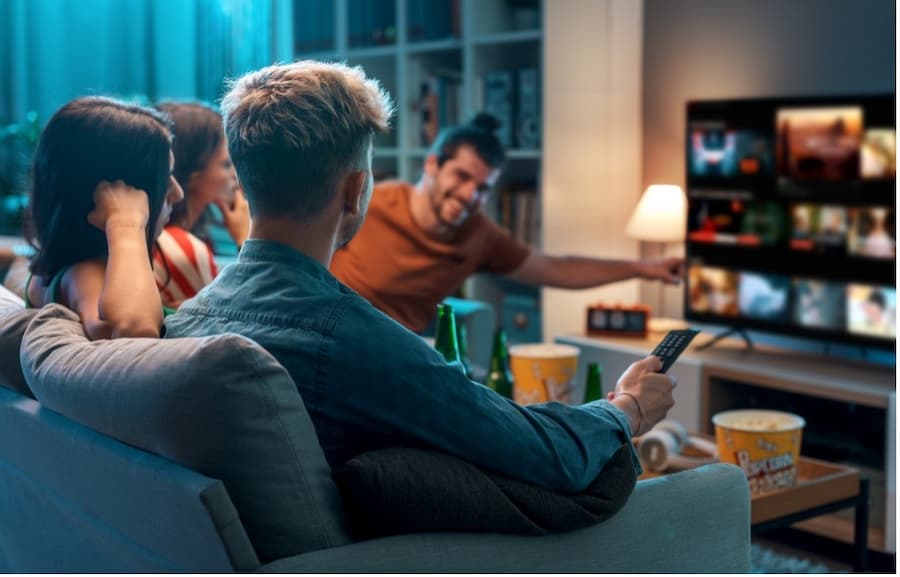 A group of people watching television